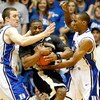 DURHAM, NC - FEBRUARY 22:  L.D. Williams #42 of the Wake Forest Demon Deacons is trapped by teammates Miles Plumlee #21 and Nolan Smith #2 of the Duke Blue Devils during their game at Cameron Indoor Stadium on February 22, 2009 in Durham, North Carolina. 
