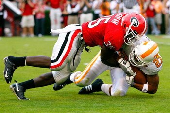 ATHENS, GA - OCTOBER 11:  Rennie Curran #35 of the Georgia Bulldogs tackles Arian Foster #27 of the Tennessee Volunteers for a loss on third down during the game at Sanford Stadium on October 11, 2008 in Athens, Georgia.  (Photo by Kevin C. Cox/Getty Imag