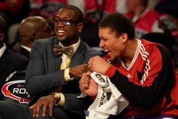 PHOENIX - FEBRUARY 13:  Assistant coach Dwyane Wade and Michael Beasley #30 of the Rookie team share a laugh during the T-Mobile Rookie Challenge & Youth Jam part of 2009 NBA All-Star Weekend at US Airways Center on February 13, 2009 in Phoenix, Arizona. 