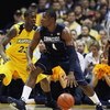 MILWAUKEE - FEBRUARY 25: Jeff Adrien #4 of the Connecticut Huskies moves against Wesley Matthews #23 of the Marquette Golden Eagles on February 25, 2009 at the Bradley Center in Milwaukee, Wisconsin. Connecticut defeated Marquette 93-82. (Photo by Jonatha