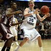 ANAHEIM, CA - MARCH 20:  Lee Cummard #30 of the Brigham Young Cougars looks to pass over the defense of Dominique Kirk #22 of the Texas A&M Aggies during the West Region first round of the NCAA Basketball Tournament at the Honda Center on March 20, 2008 i
