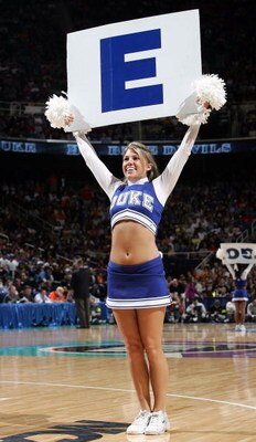 GREENSBORO, NC - MARCH 18:  A Duke Blue Devils cheerleader holds up a sign in the second half against the George Washington Colonials during the Second Round of the 2006 NCAA Men's Basketball Tournament on March 18, 2006 at the Greensboro Coliseum in Gree