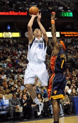 DALLAS - JANUARY 28:  Dirk Nowitzki #41 of the Dallas Mavericks takes a shot against Stephen Jackson #1 of the Golden State Warriors on January 28, 2008 at American Airlines Center in Dallas, Texas.  NOTE TO USER: User expressly acknowledges and agrees th