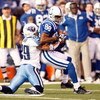 INDIANAPOLIS - DECEMBER 28:  Marvin Harrison #88 of the Indianapolis Colts grips the ball as he is sacked by Chris Carr #29 during the game against the Tennessee Titans on December 28, 2008 at Lucas Oil Stadium in Indianapolis, Indiana. (Photo by: Jamie S