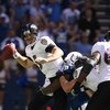 INDIANAPOLIS - OCTOBER 12:  Quarterback Joe Flacco #5 of the Baltimore Ravens looks to get rid of the ball as he's being tackled during the NFL game against the Indianapolis Colts at Lucas Oil Stadium on October 12, 2008 in Indianapolis, Indiana. The Colt
