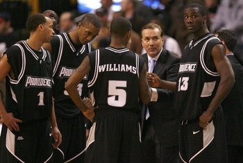 BOSTON - DECEMBER 01:  Coach Tim Welsh of the Providence confers with his team against the Boston College Eagles during Game 2 of the Hartford Hall of Fame Showcase at the TD BankNorth Garden on December 1, 2007 in Boston, Massachusetts. Providence won 98