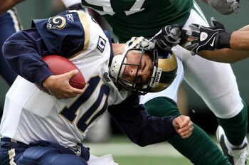 EAST RUTHERFORD, NJ - NOVEMBER 09:  Marc Bulger #10 of the St. Louis Rams is sacked against the New York Jets at Giants Stadium on November 9, 2008 in East Rutherford, New Jersey.  (Photo by Nick Laham/Getty Images)