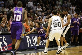 SAN ANTONIO - MAY 14: Guard Steve Nash #13 of the Phoenix Suns falls out of bounds after a flagrant foul by Robert Horry #5 of the San Antonio Spurs in Game Four of the Western Conference Semifinals during the 2007 NBA Playoffs on May 14, 2007 at AT&T Ce