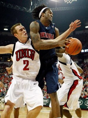 LAS VEGAS - DECEMBER 20:  Kendall Wallace #2 of the UNLV Rebels and Jordan Hill #43 of the Arizona Wildcats battle for a rebound during the first half of their game at the Thomas & Mack Center December 20, 2008 in Las Vegas, Nevada.  (Photo by Ethan Mille