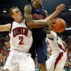 LAS VEGAS - DECEMBER 20:  Kendall Wallace #2 of the UNLV Rebels and Jordan Hill #43 of the Arizona Wildcats battle for a rebound during the first half of their game at the Thomas & Mack Center December 20, 2008 in Las Vegas, Nevada.  (Photo by Ethan Mille
