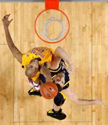 LOS ANGELES, CA - JANUARY 31:  Taj Gibson (L) #22 of the USC Trojans and Harper Kamp #43 of the Cal Golden Bears battle for a rebound during the second half at the Galen Center on January 31, 2009 in Los Angeles, California. USC defeated Cal 73-62.  (Phot