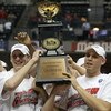 INDIANAPOLIS - MARCH 16:  (L-R) Brian Butch #32 and Greg Stiemsma #34 of the Wisconsin Badgers celebrate with the tournament championship trophy after their 61-48 win against the Illinois Fighting Illini during the Championship game of the Big Ten Men's B