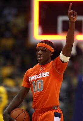 MILWAUKEE - MARCH 07: Jonny Flynn #10 of the Syracuse Orange celebrates a win over the Marquette Golden Eagles on March 7, 2009 at the Bradley Center in Milwaukee, Wisconsin. Syracuse defeated Marquette 86-79 in overtime. (Photo by Jonathan Daniel/Getty I