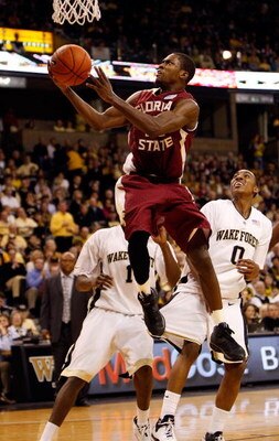 WINSTON-SALEM, NC - FEBRUARY 14:  Toney Douglas #23 of the Florida State Seminoles goes to the basket as Jeff Teague #0 of the Wake Forest Demon Deacons watches on during their game at Lawrence Joel Coliseum on February 14, 2009 in Winston-Salem, North Ca