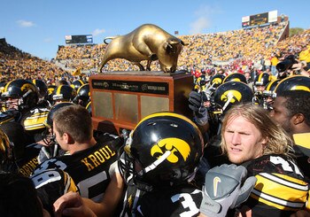 18 OCTOBER 2008: Iowa defensive lineman Mitch King (47) and his fellow players hold the Heartland Trophy after an NCAA college football game against Wisconsin, at Kinnick Stadium in Iowa City, Iowa on Saturday Oct. 18, 2008. Iowa won 38-16.