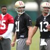 SANTA CLARA, CA - MAY 01:  Michael Crabtree #15 of the San Francisco 49ers looks on during practice as quaterback Alex Smith #11 and Shaun Hill #13 practice during the 49ers Minicamp at their training facilities on May 1, 2009 in Santa Clara, California. 