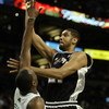 BOSTON - JANUARY 22:  Tim Duncan #21 of the San Antonio Spurs takes a shot as Al Jefferson #7 of the Boston Celtics defends at the TD Banknorth Garden January 22, 2007 in Boston, Massachusetts. The San Antonio Spurs defeated the Boston Celtics 93-89.  NOT