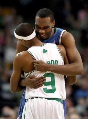 BOSTON - FEBRUARY 01:  Al Jefferson #25 of Minnesota Timberwolves and  Rajon Rondo #9 of the Boston Celtics greet each other before the game on February 1, 2009 at TD Banknorth Garden in Boston, Massachusetts. NOTE TO USER: User expressly acknowledges and