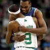 BOSTON - FEBRUARY 01:  Al Jefferson #25 of Minnesota Timberwolves and  Rajon Rondo #9 of the Boston Celtics greet each other before the game on February 1, 2009 at TD Banknorth Garden in Boston, Massachusetts. NOTE TO USER: User expressly acknowledges and