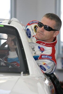 LAS VEGAS - FEBRUARY 27:  Bobby Labonte driver of the #96 ASK.com Ford climbs into his car before practice for the NASCAR Sprint Cup Series Shelby 427 at the Las Vegas Motor Speedway on February 27, 2009 in Las Vegas, Nevada.  (Photo by John Harrelson/Get