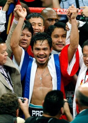 LAS VEGAS - DECEMBER 06:  Manny Pacquiao of the Philippines celebrates his victory over Oscar De La Hoya in their welterweight bout at the MGM Grand Garden Arena December 6, 2008 in Las Vegas, Nevada.  (Photo by Ethan Miller/Getty Images)