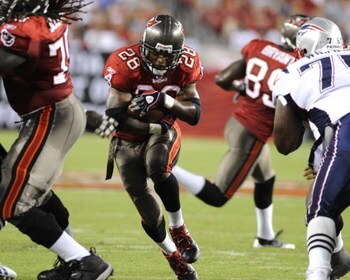 TAMPA, FL - AUGUST 17: Running back Warrick Dunn #28 of the Tampa Bay Buccaneers rushes upfield against the New England Patriots at Raymond James Stadium on August 17, 2008 in Tampa, Florida.   (Photo by Al Messerschmidt/Getty Images)