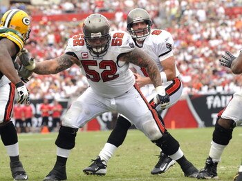 TAMPA, FL - SEPTEMBER 28: Center Jeff Faine #52 of the Tampa Bay Buccaneers blocks against the Green Bay Packers at Raymond James Stadium on September 28, 2008 in Tampa, Florida.  (Photo by Al Messerschmidt/Getty Images) 
