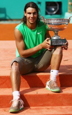 PARIS - JUNE 08:  Rafael Nadal of Spain poses with the trophy following his victory during the Men's Singles Final match against Roger Federer of Switzerland on day fifteen of the French Open at Roland Garros on June 8, 2008 in Paris, France.  (Photo by J