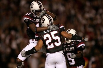 COLUMBIA, SC - NOVEMBER 01:  Teammates Moe Brown #9 and Kenny McKinley #11 celebrate with Mike Davis #25 after his touchdown against the Tennessee Volunteers # of the South Carolina Gamecocks during their game at Williams-Brice Stadium on November 1, 2008