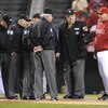 ANAHEIM, CA - OCTOBER 08:  Mike Scioscia #14 manager of the Los Angeles Angels of Anaheim speaks to the umpires at the start Game One of the ALDS against the Boston Red Sox during the 2009 MLB Playoffs at Angel Stadium on October 8, 2009 in Anaheim, Calif