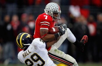 COLUMBUS, OH - NOVEMBER 18:  Ted Ginn Jr. of the Ohio State Buckeyes makes a reception for a 39-yard touchdown in the second quarter against Leon Hall #29 of the Michigan Wolverines November 18, 2006 at Ohio Stadium in Columbus, Ohio. The touchdown gave t