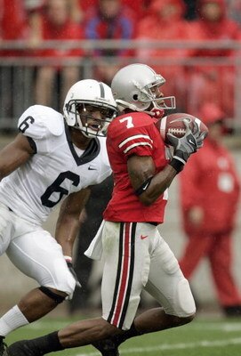COLUMBUS, 0H - SEPTEMBER 23: Ted Ginn Jr. #7 of Ohio State Buckeyes carries the ball against Donnie Johnson #6 of the Penn State Nittany Lions on September 23, 2006 at Ohio Stadium in Columbus, Ohio. (Photo By Gregory Shamus/Getty Images)  