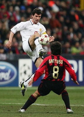 MILAN, ITALY - MARCH 8:  Roy Keane of Manchester United challenges Gattuso of AC Milan during the UEFA Champions League match between AC Milan and Manchester United on March 8, 2005 at the San Siro Stadium in Milan, Italy. (Photo by Mike Hewitt/Getty Imag