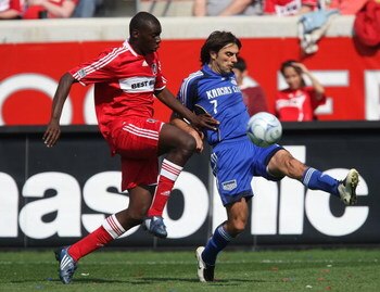 BRIDGEVIEW, IL - APRIL 20: Claudio Lopez #7 of the Kansas City Wizards fires a shot past Bakary Soumare #4 of the Chicago Fire on April 20, 2008 at Toyota Park in Bridgeview, Illinois. The Wizards defeated the Fire 1-0. (Photo by Jonathan Daniel/Getty Ima