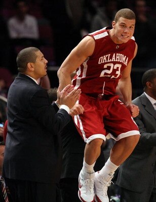 NEW YORK - NOVEMBER 28: Blake Griffin #23 of the Oklahoma Sooners celebrates on the sideline next to head coach Jeff Capel against the Purdue Boilermakers during the Championship game of the Pre-Season NIT tournament on November 28, 2008 at Madison Square