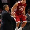 NEW YORK - NOVEMBER 28: Blake Griffin #23 of the Oklahoma Sooners celebrates on the sideline next to head coach Jeff Capel against the Purdue Boilermakers during the Championship game of the Pre-Season NIT tournament on November 28, 2008 at Madison Square