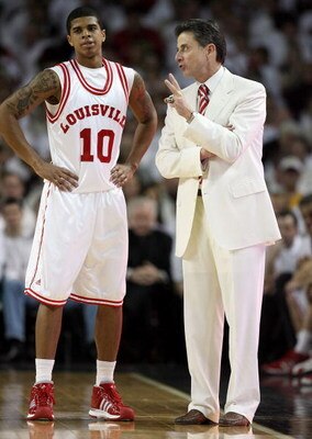 LOUISVILLE, KY - MARCH 01:  Rick Pitino the Head Coach of the Louisville Cardinals gives instructions to Edgar Sosa #10 during the Big East Conference game against the Marquette Golden Eagles at Freedom Hall on March 1, 2009 in Louisville, Kentucky.  (Pho