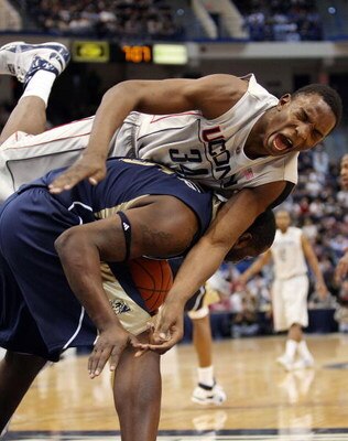 HARTFORD, CT - FEBRUARY 16:  Hasheem Thabeet #34 of the Connecticut Huskies and DeJuan Blair #45 of the Pittsburgh Panthers fight for the rebound on February 16, 2009 at XL Center  in Hartford, Connecticut. Thabeet was thrown to the ground on the play.  (
