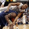 HARTFORD, CT - FEBRUARY 16:  Hasheem Thabeet #34 of the Connecticut Huskies and DeJuan Blair #45 of the Pittsburgh Panthers fight for the rebound on February 16, 2009 at XL Center  in Hartford, Connecticut. Thabeet was thrown to the ground on the play.  (