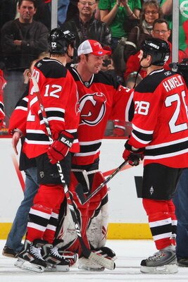 NEWARK, NJ - MARCH 17:  Goaltender Martin Brodeur #30 of the New Jersey Devils (C) celebrates the 3-2 victory over the Chicago Blackhawks with teammates Brian Rolston #12 and Niclas Havelid #28 at the Prudential Center on March 17, 2009 in Newark, New Jer