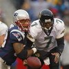 FOXBORO, MA - DECEMBER 14:  Richard Seymour #93 of the New England Patriots strips the ball from Brian Leftwitch #7 of the Jacksonville Jaguars on December 14, 2003 at Gillette Stadium in Foxboro, Massachusetts.  (Photo by Rick Stewart/Getty Images)