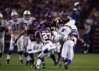 MINNEAPOLIS - SEPTEMBER 14:  Wide receiver Anthony Gonzalez (R) #11 of the Indianapolis Colts is tackled by Tyrell Johnson #25 of the Minnesota Vikings in the fourth quarter at the Metrodome on September 14, 2008 in Minneapolis, Minnesota. The Colts defea