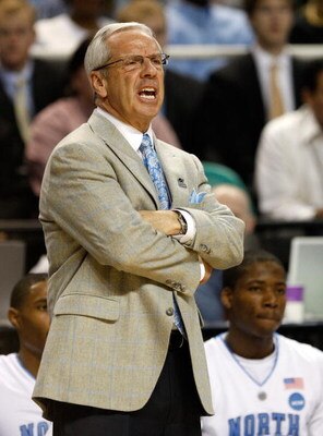 GREENSBORO, NC - MARCH 19:  Head coach Roy Williams of the North Carolina Tar Heels yells to his team against the Radford Highlanders during the first round of the NCAA Division I Men's Basketball Tournament at the Greensboro Coliseum on March 19, 2009 in