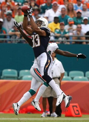 MIAMI - OCTOBER 05:  Wide receiver Vincent Jackson #83 of the San Diego Chargers grabs a reception over cornerback Andre Goodman #21 of the Miami Dolphins at Dolphin Stadium on October 5, 2008 in Miami, Florida. The Dolphins defeated the Chargers 17-10.  