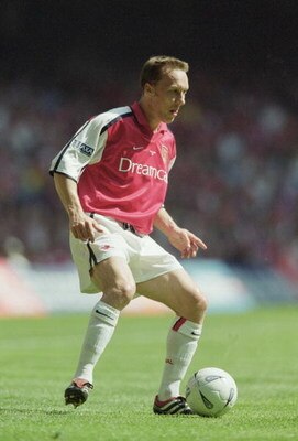 12 May 2001:  Lee Dixon of Arsenal runs with the ball during the AXA sponsored FA Cup Final against Liverpool played at the Millennium Stadium, in Cardiff, Wales. Liverpool won the match and cup 2-1. \ Mandatory Credit: Ben Radford /Allsport