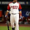 MIAMI - MARCH 16:  Ramon Vazquez #12 of Puerto Rico reacts to a called third strike in the first inning Venezuela during day 3 of round 2 of the World Baseball Classic at Dolphin Stadium on March 16, 2009 in Miami, Florida.  (Photo by Doug Benc/Getty Imag