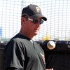 BRADENTON, FL - MARCH 8:  Manager John Russell #7 of the Pittsburgh Pirates tosses a ball before play against the Houston Astros March 8, 2009 at McKechnie Field in Bradenton, Florida.  (Photo by Al Messerschmidt/Getty Images)