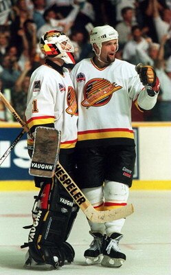 11 JUN 1994: CANUCKS DEFENSEMAN BRENT HEDIGAN CELEBRATES WITH GOALTENDER KIRK MCLEAN AFTER DEFEATING THE RANGERS, 4-1, IN GAME SIX OF THE STANLEY CUP FINALS IN VANCOUVER, BRITISH COLUMBIA. THE WIN TIES THE SERIES AT 3-3. GAME SEVEN WILL BE PLAYED IN NEW Y
