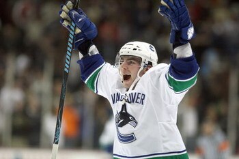 ANAHEIM - OCTOBER 31:  Alexandre Burrows #14 of the Vancouver Canucks celebrates during the game against the Anaheim Ducks at the Honda Center on October 31, 2008 in Anaheim, California. (Photo by: Jeff Gross/Getty Images)