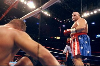 13 Feb 1999:  Butterbean looks down on Patrick Graham after he is knocked down into the ropes during the fight at Thomas & Mack Center in Las Vegas, Nevada. Mandatory Credit: Al Bello  /Allsport